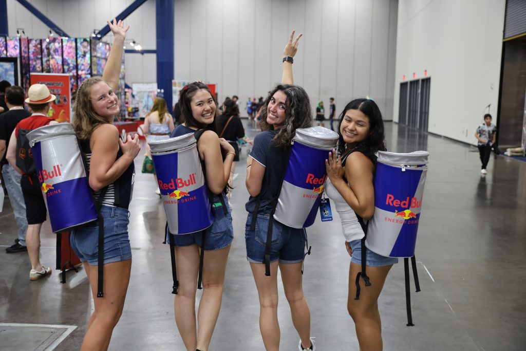 Brand ambassadors with Red Bull coolers at a Flashbar event activation