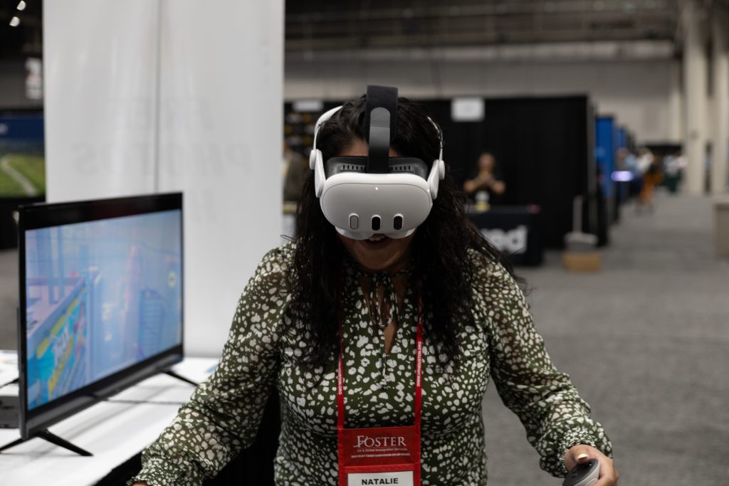 Attendee playing a VR game with a headset at a Flashbar VR activation booth