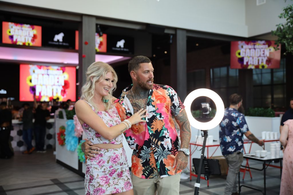Couple posing at an event with a Flashbar ring-light photo booth
