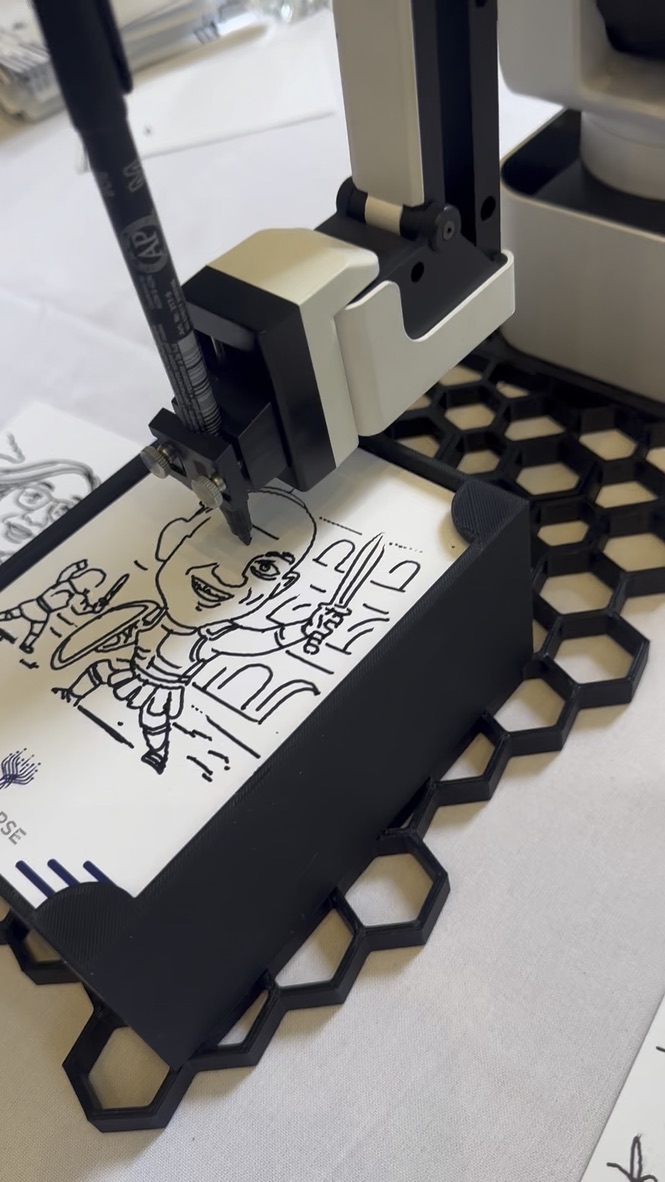 Flashbar AI Drawbot machine sketching a caricature at an event