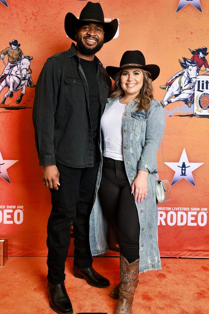 Couple in cowboy hats at the Houston Rodeo photo booth backdrop